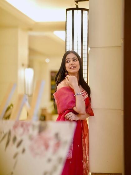 Modeling a beautiful pink kurta set, perfect for a puja or a small family gathering.