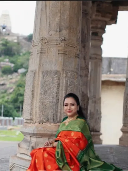 Seated among the ancient pillars, I feel a deep connection to our heritage. Our sarees are woven with this same reverence for tradition.