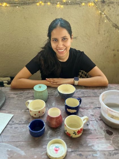 Look at the beautiful creations from this student who completed the intense potter's wheel course. Each piece is a masterpiece, adorned with colorful glazes and intricate, hand-painted details.