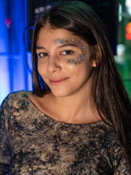 Another beautiful shot of a guest with artistic face glitter. My parties are a space for self-expression and creativity.