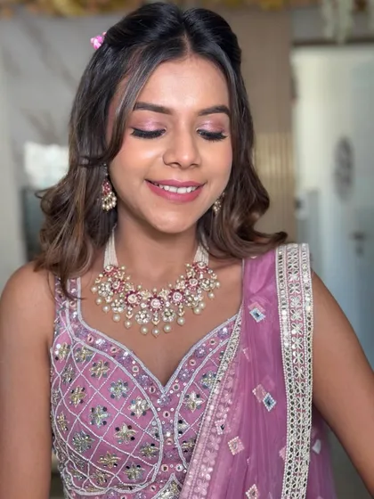 A close-up showing the soft texture of the hair and the delicate details of the half-up style.