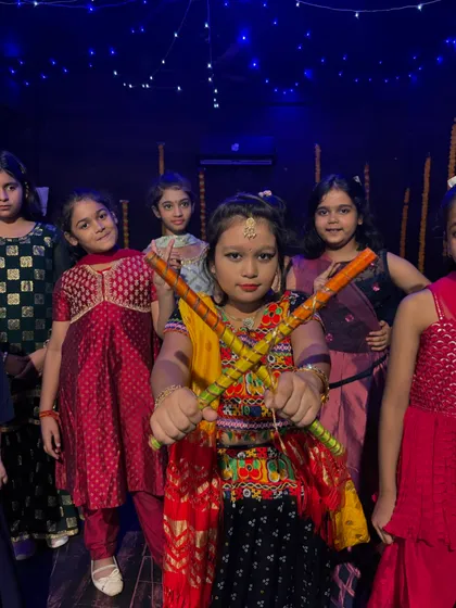 Our kids' batch, dressed in colorful traditional outfits, ready for their Navratri performance.
