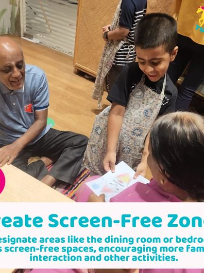 Creating screen-free zones, like our play areas, encourages more family interaction. Here, a family enjoys a crafting activity together.