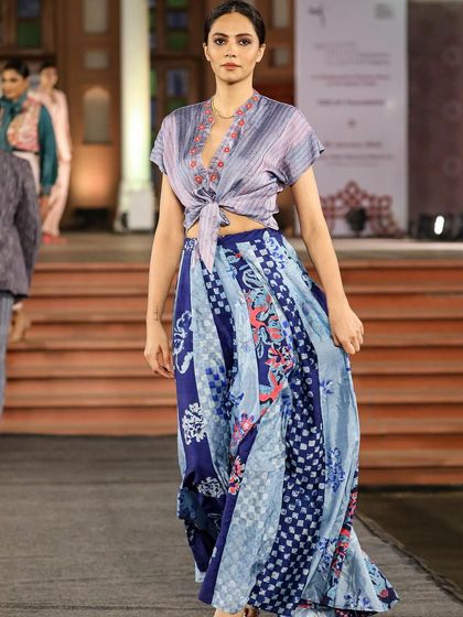 A collection from the 'Walking Hand in Hand' fashion show, where artisans share the spotlight with designers. This look, created with Liz Hartman, showcases pattern dye and discharge prints on handloom fabrics.
