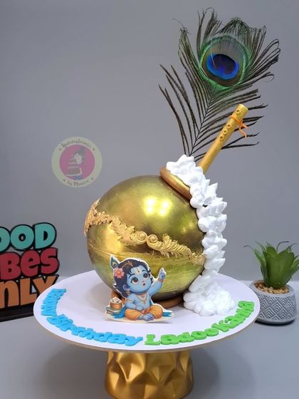 A golden matki piñata cake for Janmashtami, with cream overflowing like butter.