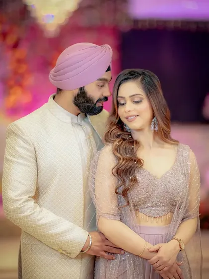 A close, romantic portrait of Simran and Sanjit, their expressions full of love and admiration for each other.