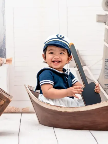 Captain Adorable reporting for duty, ready to sail into a sea of smiles.