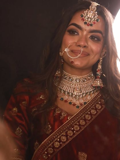 A close up that captures the beautiful smile and the sparkle of the Rajwadi style nath and choker.