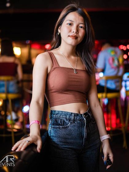 A guest posing at the bar.