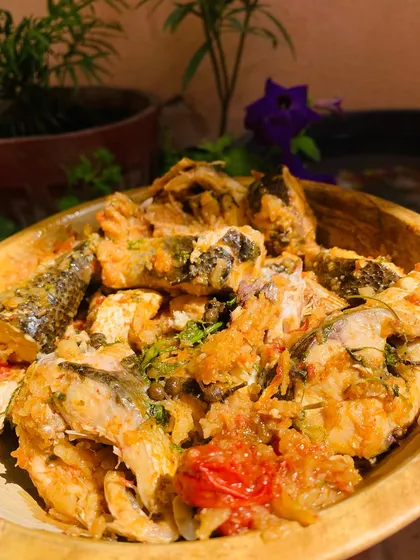 The beautiful colors of the fresh fish curry in the sunlight.