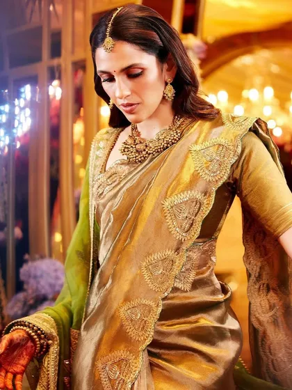 A close-up of the Masaba saree, highlighting the beautiful drape and the intricate gold border.