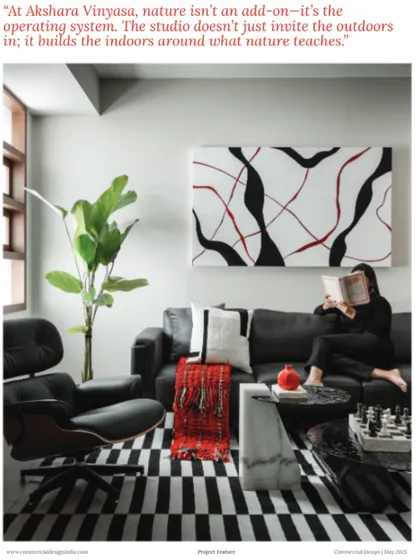 A quote from our feature in Commercial Design: "At Akshara Vinyasa, nature isn’t an add-on, it’s the operating system." This image captures the comfortable and nature-connected lounge area within our studio.