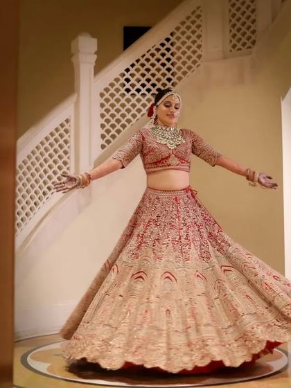 A joyful twirl from the bride, showing off the beautiful movement and detail of her lehenga. These dynamic shots add energy and happiness to the bridal gallery.