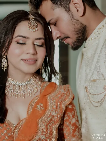 A moment of quiet connection amidst the celebration. This close-up portrait captures the serene and loving bond between the couple, a peaceful pause on their wedding day.