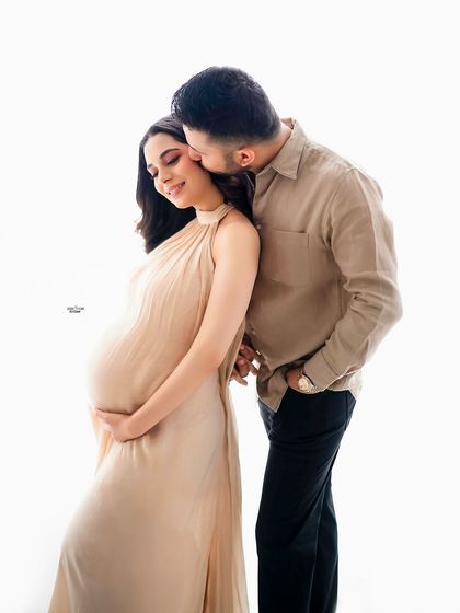 A sweet kiss on the cheek is always a perfect moment to capture. It shows so much love and affection.