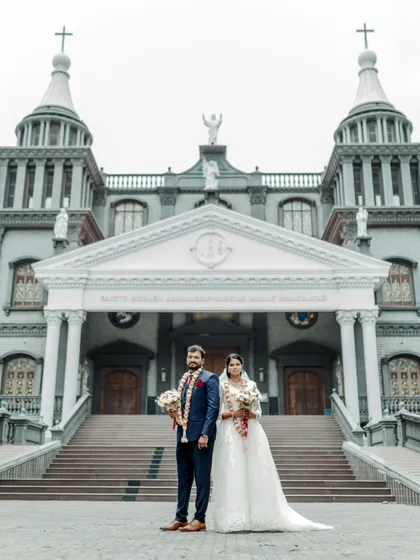 A timeless portrait of a couple after their Christian wedding ceremony in Udupi. I work to frame these moments against grand architectural backdrops to create truly epic and memorable wedding photographs.