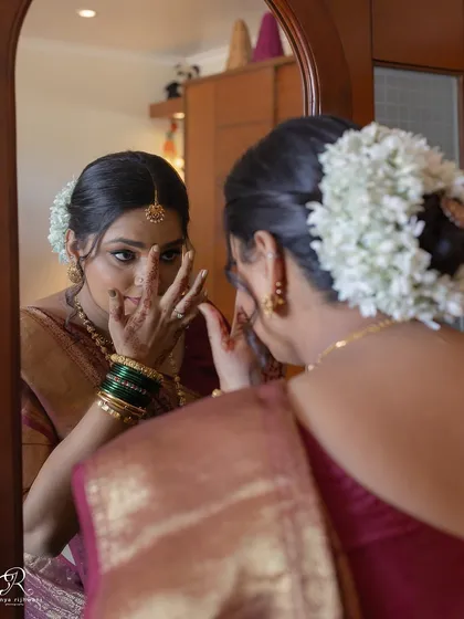 A quiet moment of reflection for the bride as she gets ready in her room for her home wedding.
