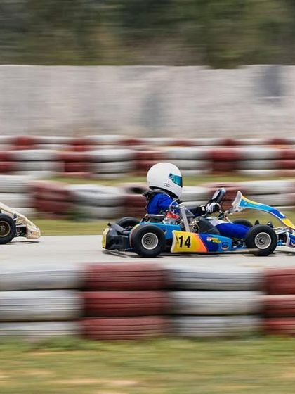 A pack of junior and micro drivers learning their racecraft in a competitive setting.