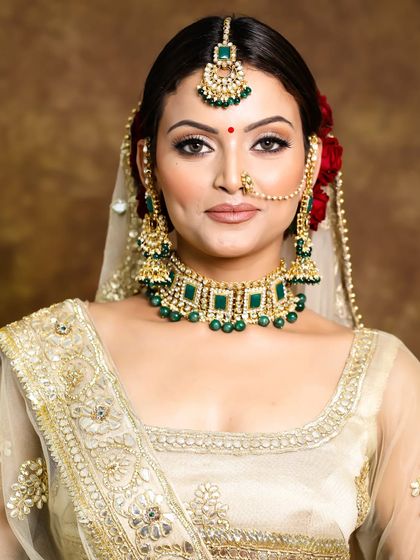 Another angle of this classic bridal look. The makeup was designed to be flawless from every view, highlighting her features with a soft glow and defined eyes.