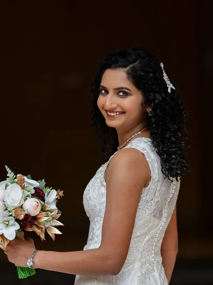 A classic bridal portrait. The soft glam makeup and elegant hairstyle create a look that is both modern and timeless.