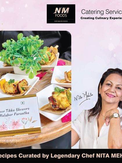 A classic appetizer, Paneer Tikka Skewers, served on a flaky Malabar Paratha. This combination offers a complete and satisfying bite, perfect as a substantial pass-around snack.