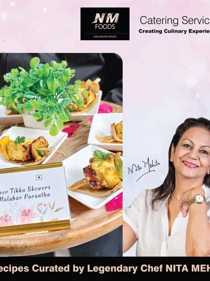 A classic appetizer, Paneer Tikka Skewers, served on a flaky Malabar Paratha. This combination offers a complete and satisfying bite, perfect as a substantial pass-around snack.