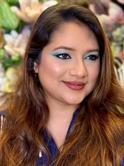 A side profile showing the beautiful blending of the teal shadow. Makeup is about character, and this look has plenty.