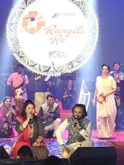 Seated on stage with Parthiv Gohil, co-hosting a segment. Our long-standing collaboration is built on great chemistry and a shared passion for performance.