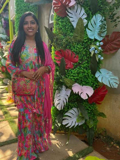 A full-length view of my colourful sharara outfit, perfect for a lively Mehendi celebration. I believe in looking the part to enhance the festive wedding atmosphere.