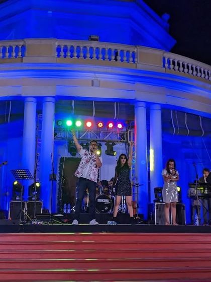 Performing at the Madras Club for a New Year's Eve bash. This photo captures the scale of the event, with the band on a grand stage, ready to bring in the new year with a bang.