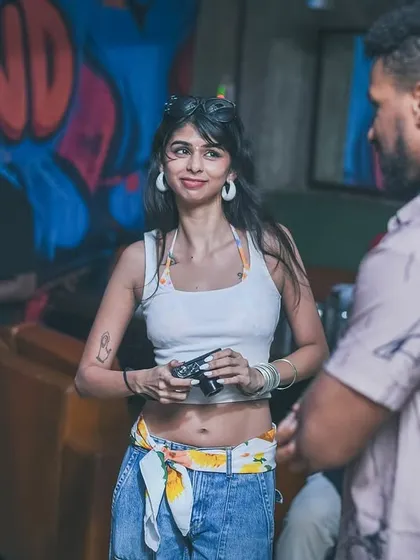 A candid shot of a guest, poet Aranya Johar, at The Grind.