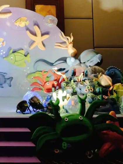 Another angle of the detailed underwater stage, showcasing the different layers and props that bring the theme to life.