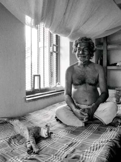 A timeless portrait of artist Ramkinkar Baij with his cat. We are deeply inspired by the profound connection between people and their animals throughout history, a bond we aim to honor in our own work.