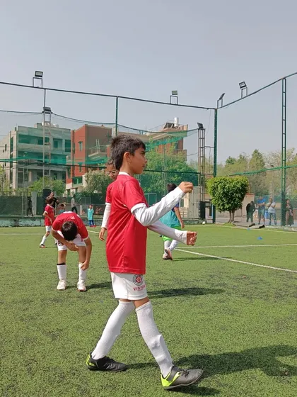 A player walks with focus during a break in play at the Youth Super Cup. Every moment on the field is a chance to learn.