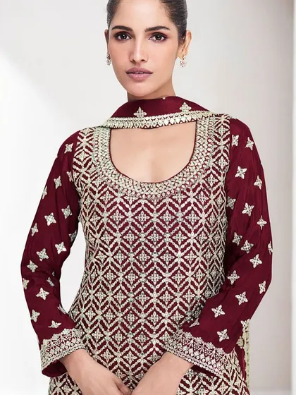 This maroon Chinon silk palazzo suit is perfect for a winter wedding. The heavy thread embroidery and sequins add a festive sparkle.