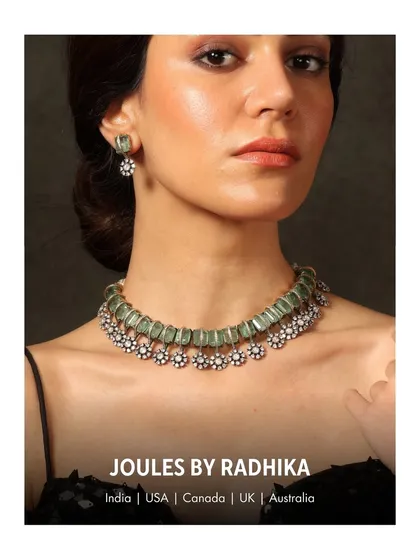 A close-up of the delicate mint-green beaded choker with floral motifs, as worn by the stylish Kriti Sanon.