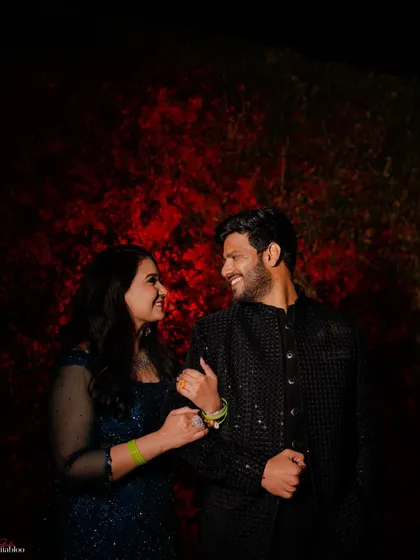 A simple yet powerful portrait using a red-lit background. We love playing with color and shadow to create moody and romantic couple portraits during evening events.