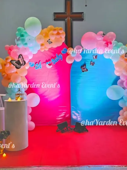 A unique gender reveal setup with two colored backdrops, pink and blue, ready for the big announcement.
