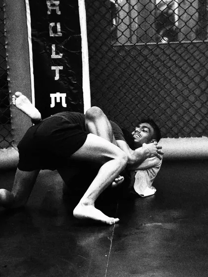 This black and white shot captures the struggle and focus of a grappling exchange. Wrestling is a mental battle as much as a physical one, demanding resilience and a deep understanding of leverage and control.
