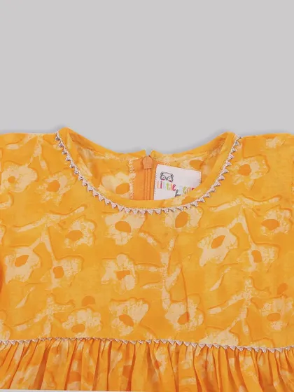 A close-up of the delicate stitching around the neckline of one of our floral dresses. I believe true fashion isn't just what you wear, but how it makes you feel.