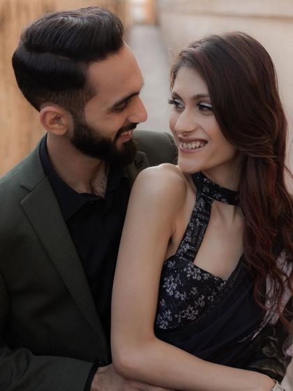 A joyful, natural smile shared between the couple. Even in the most regal settings, we focus on capturing the genuine happiness and laughter that define your relationship.