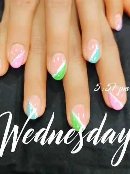 A playful design with diagonal color blocks in pastel shades, separated by a thin line of silver glitter.