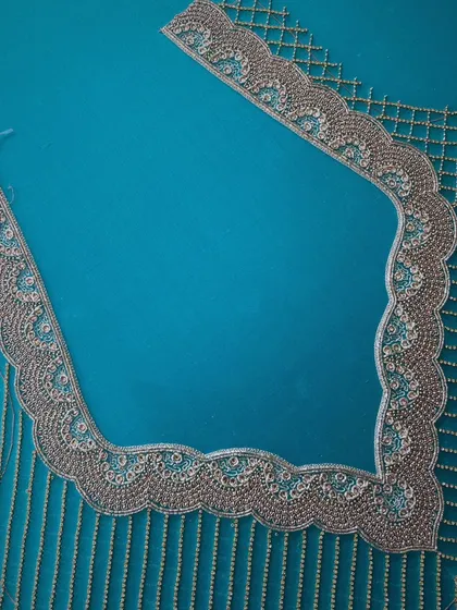 I believe in unleashing the artistry of my skilled artisans through intricate hand embroidery. This close-up reveals how we turn designer blouses into timeless expressions of elegance, elevating your style with every stitch.