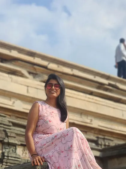Posing on the steps of a temple ruin in Hampi.