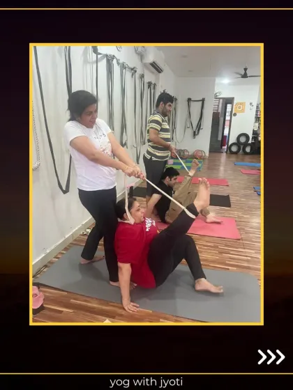 Using a prop like a strap in partner yoga allows for a safer and deeper stretch. Teamwork makes the pose work.