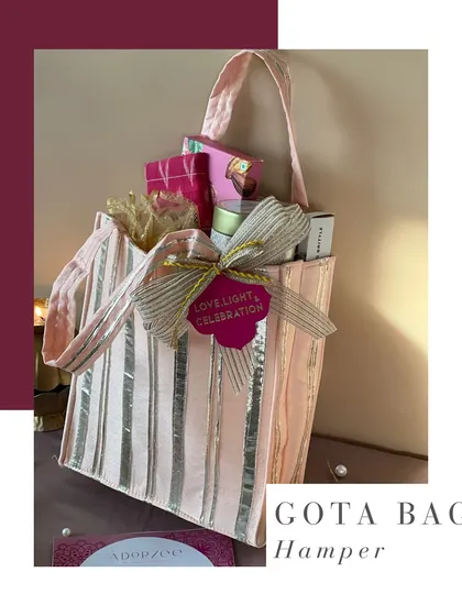 Our gota bag hamper is a stylish and convenient option for Diwali. The shimmering bag is filled with a curated selection of treats and is finished with a beautiful bow and a 'Love, Light & Celebration' tag.