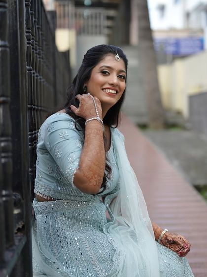 A happy and relaxed portrait of the bride. Her makeup is fresh and natural, allowing her joyful smile to be the focus.