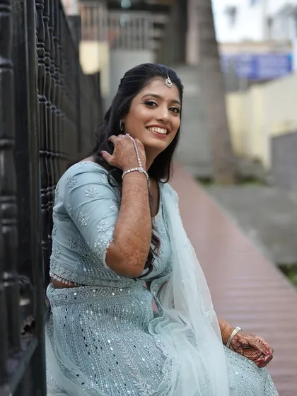 A happy and relaxed portrait of the bride. Her makeup is fresh and natural, allowing her joyful smile to be the focus.