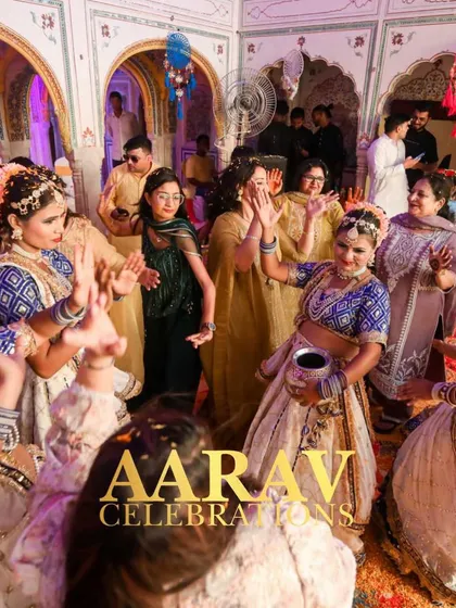 Guests and performers dance together during a Brij-style Holi celebration. I aim to create interactive themes where the family and friends become part of the performance itself.