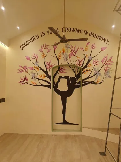 Art can create an atmosphere of peace and mindfulness. For this yoga studio, I designed a mural that integrates the form of a yogi into a tree of life, with the mantra "Grounded in Yoga, Growing in Harmony." It transforms the space into a sanctuary for reflection and flow.
